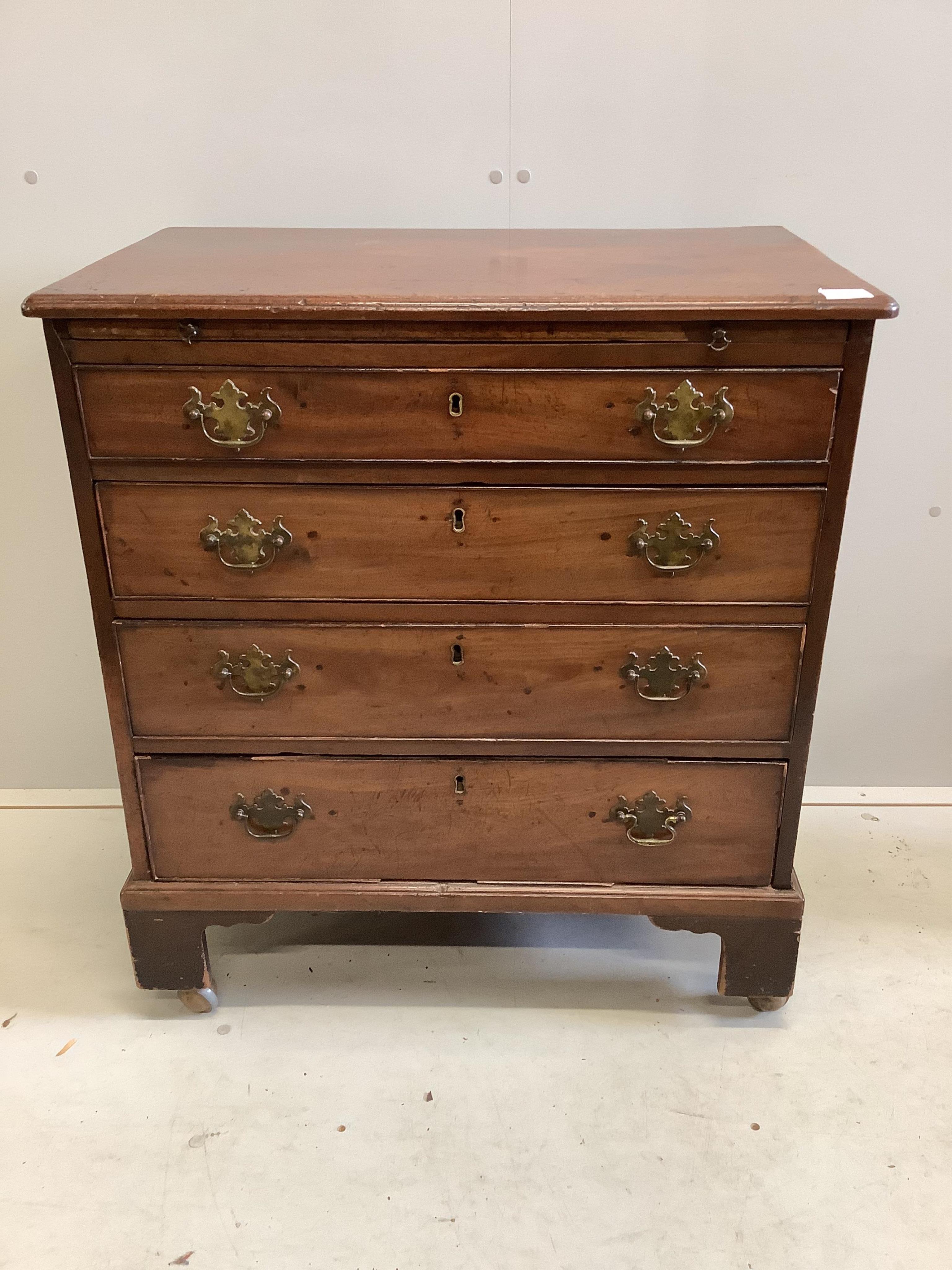 A small George III mahogany chest of four graduated drawers, fitted slide, width 76cm, depth 46cm, height 84cm